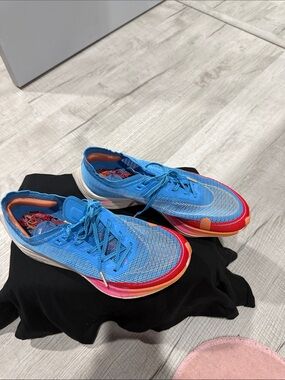 Nike Blue Athletic Shoes with Red and Orange Accents